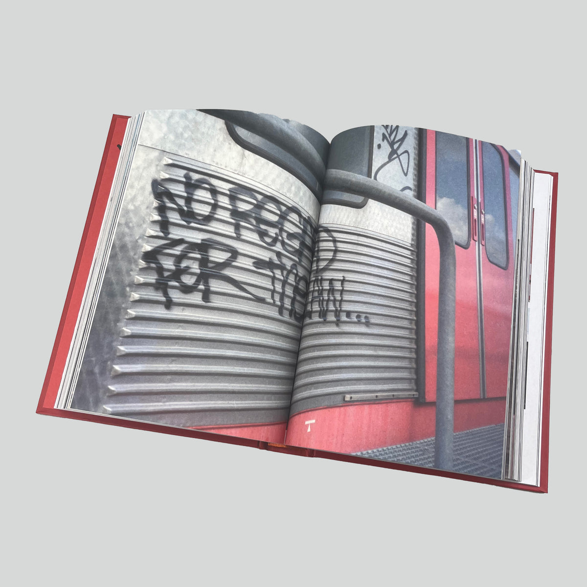 Catalogue of Unsolved Crimes, open spread with a close-up of a tag on a train