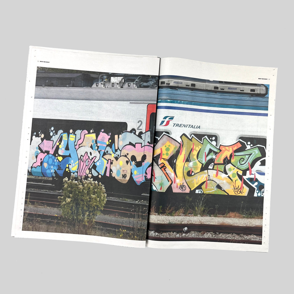 Why Oh Why, open spread with a painted train across both pages