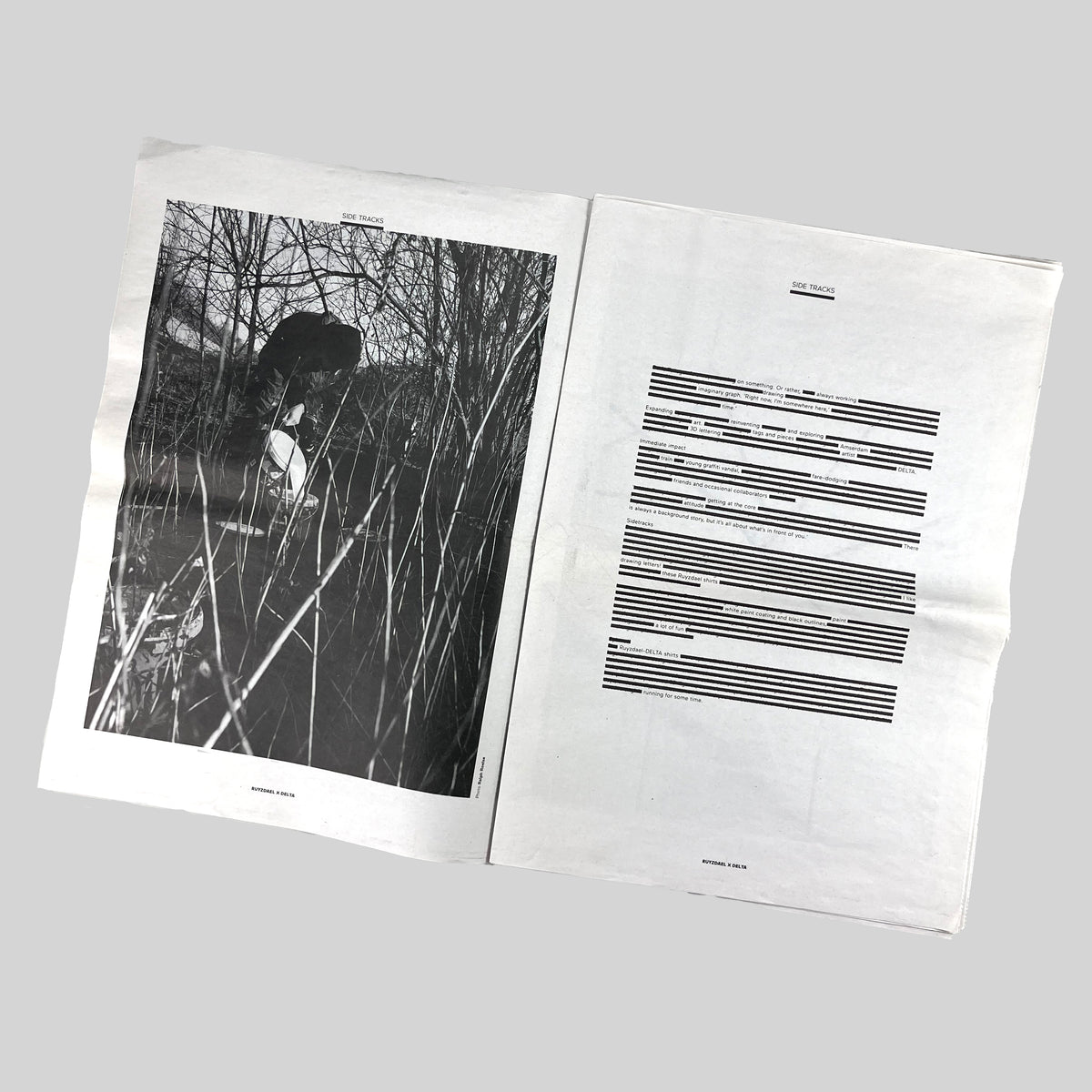 Side Tracks, open spread with a black-and-white photograph and a page of text