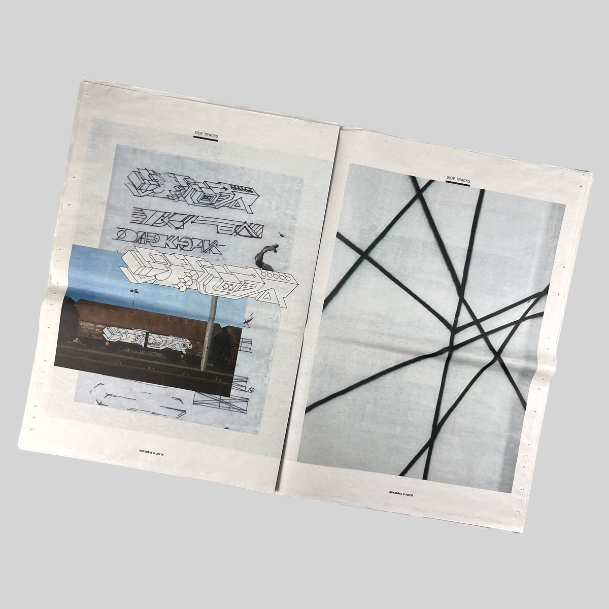 Side Tracks, open spread with letter drawings, a photograph of a freight wagon and crossing black lines