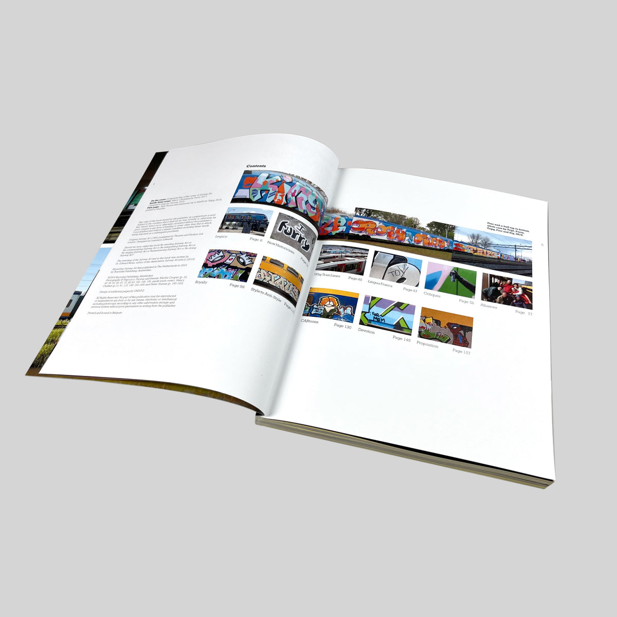 Repainting Subway Art, open spread with a text page and small photographs of trains
