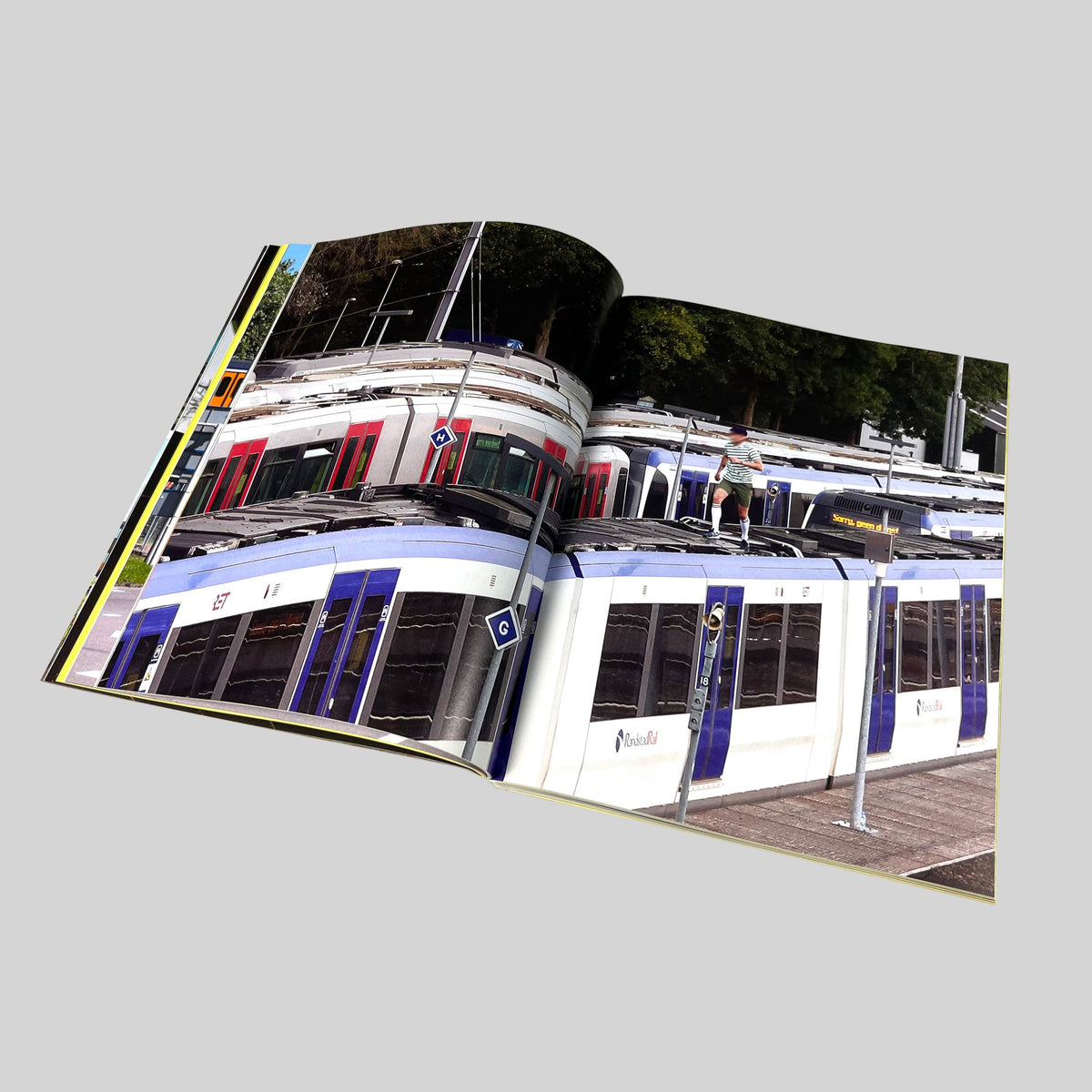 Repainting Subway Art, open spread with a photograph of trains at a platform