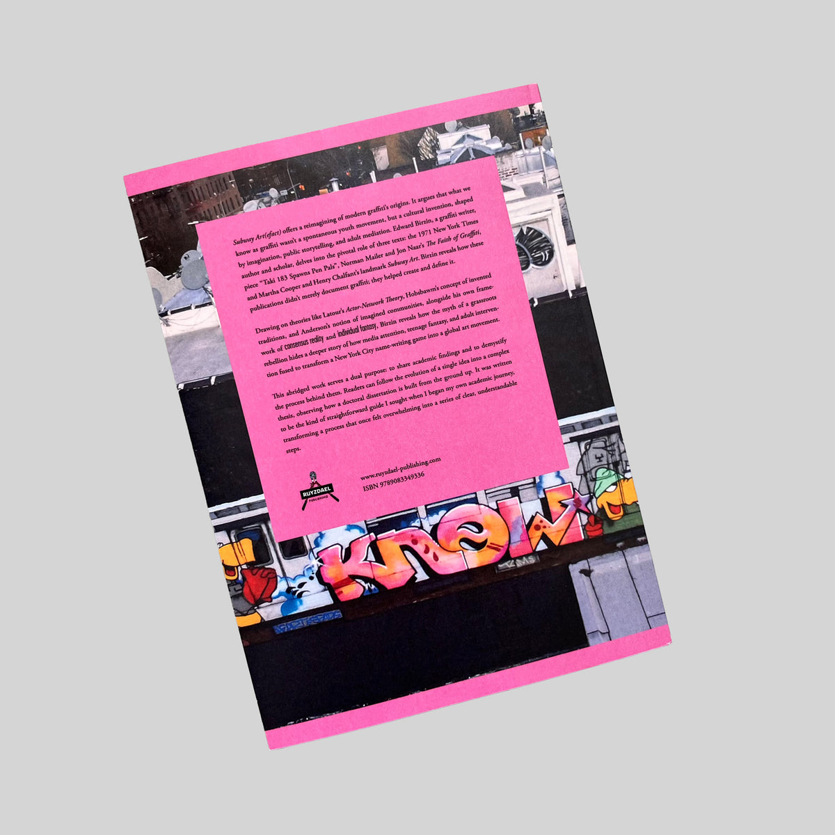 Subway Art(efact), back cover with text on a pink panel, seen at an angle