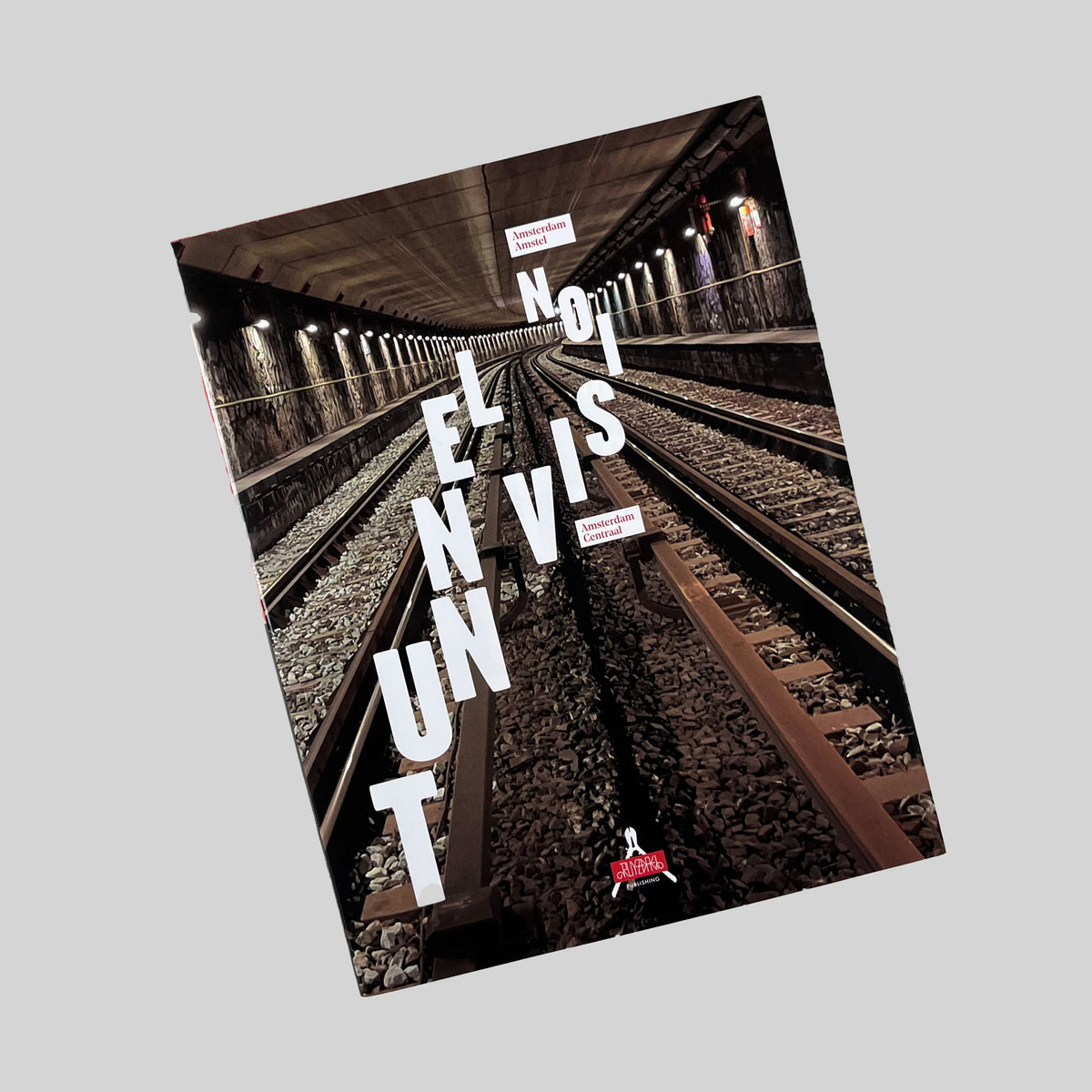 Tunnel Vision, cover showing metro tracks in a lit tunnel, seen at an angle
