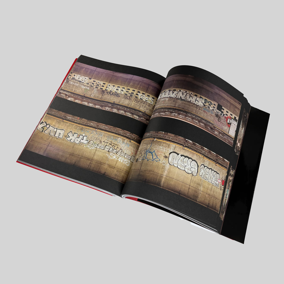 Tunnel Vision, open spread with photographs of large graffiti pieces along the tunnel walls