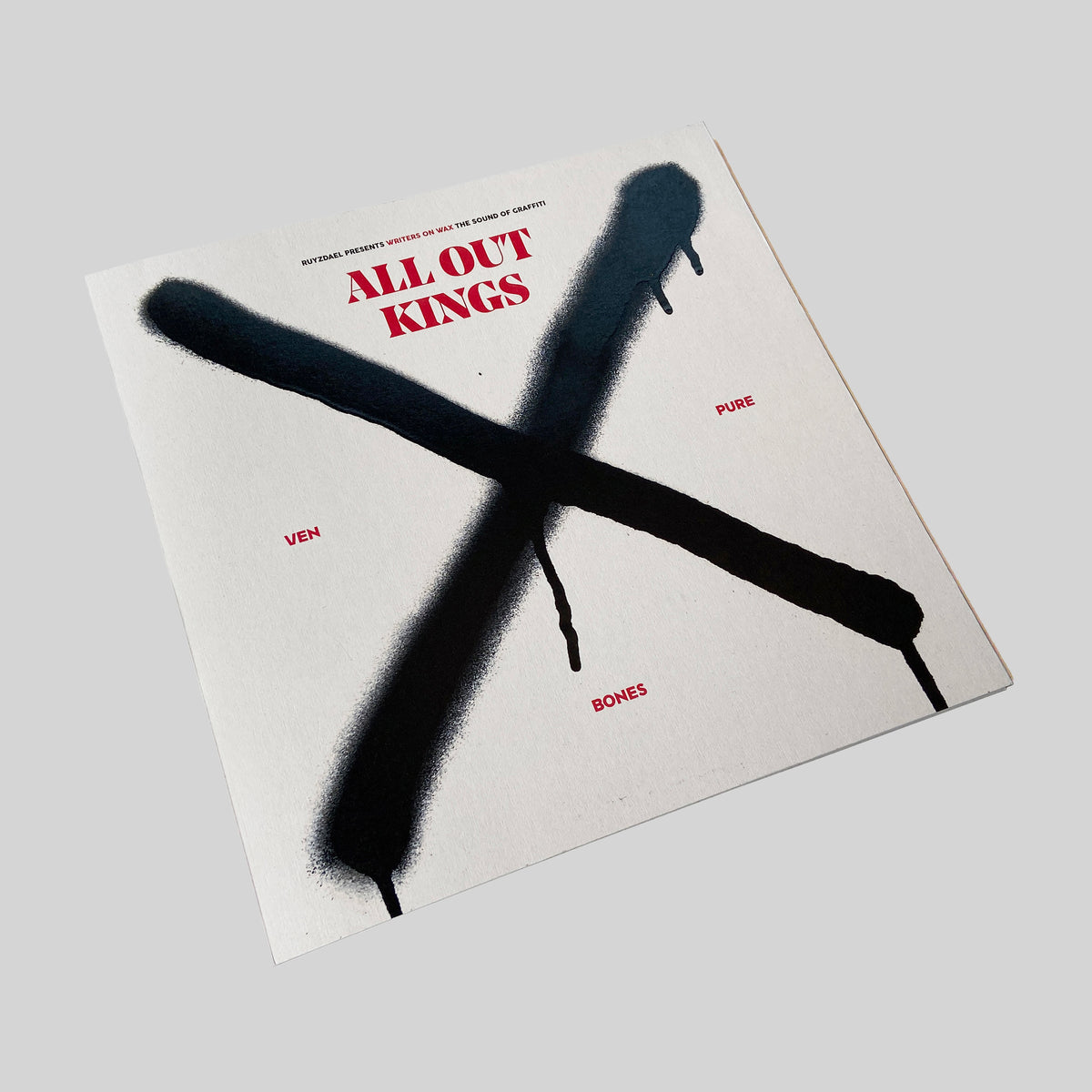 Writers on Wax All Out Kings, sleeve with a black spray-painted X, seen at an angle